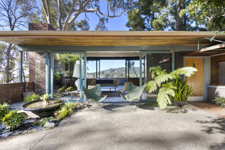 midcentury home in the hollywood hills post and beam with green foliage