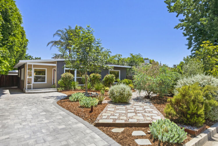 exterior of a traditional home showing drought tolerant landscaping