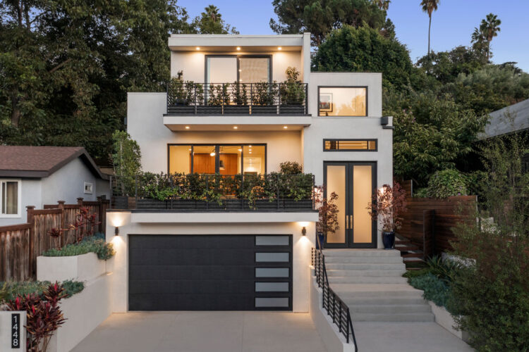 exterior of a white and black three story modern home