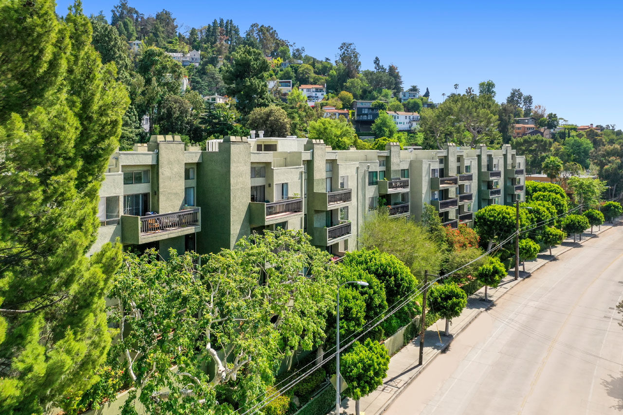 drone image of a green condo community in the hills of Silver Lake