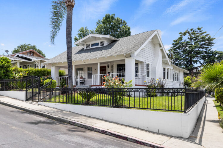 exterior of a white craftsman style home in highland park