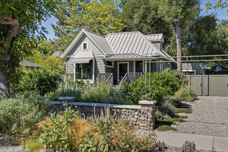 image of a grey home with abundant california native plants