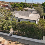 exterior of a tradtional home painted white with black trim