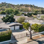 exterior of a tradtional home painted white with black trim