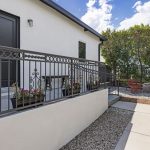 exterior of a tradtional home painted white with black trim