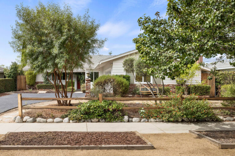 Exterior of a ranch style home with drought tolerant landscaping