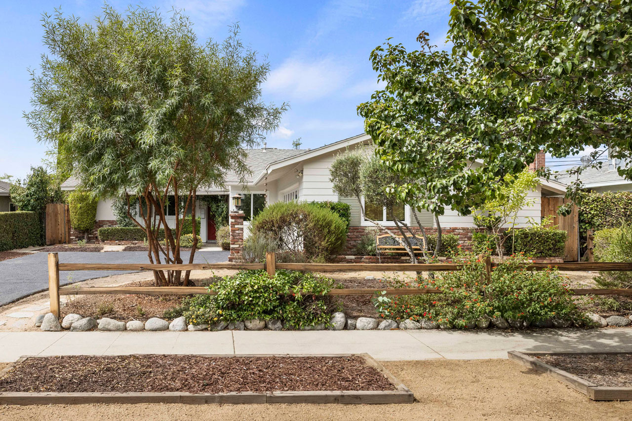 Exterior of a ranch style home with drought tolerant landscaping