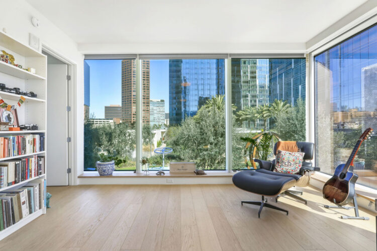 view from a condo with floor to ceiling windows shoing a view of downtown