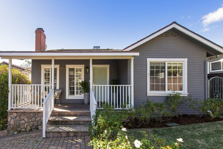 exterior of a traditional home painted blue with white trim