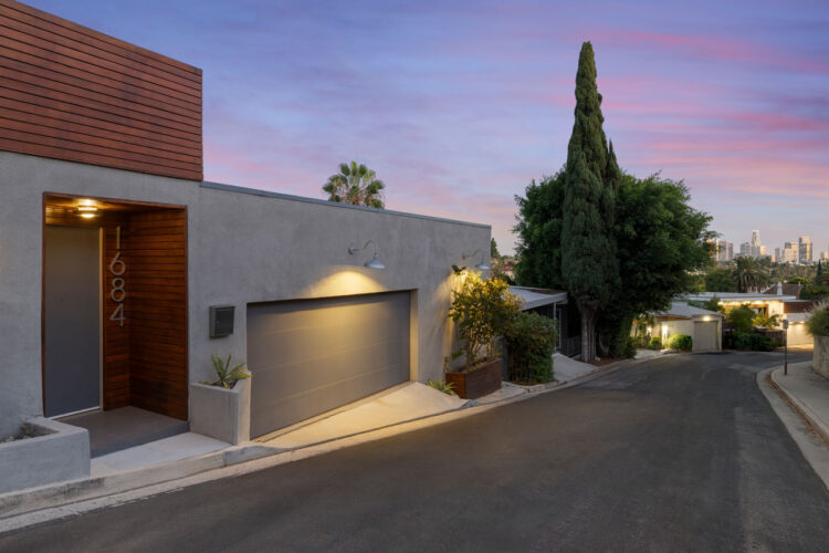 1684 Rotary Dr Silver Lake exterior of a contemporary hillside home painted grey surrounded by trees