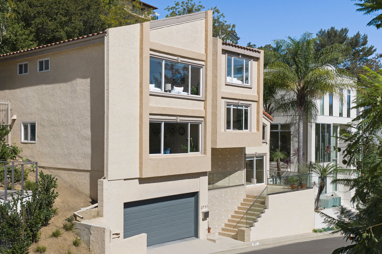 3751 Prestwick Dr Los Feliz, Contemporary Hillside Home for Sale Three stories, beige and with a grey garage door