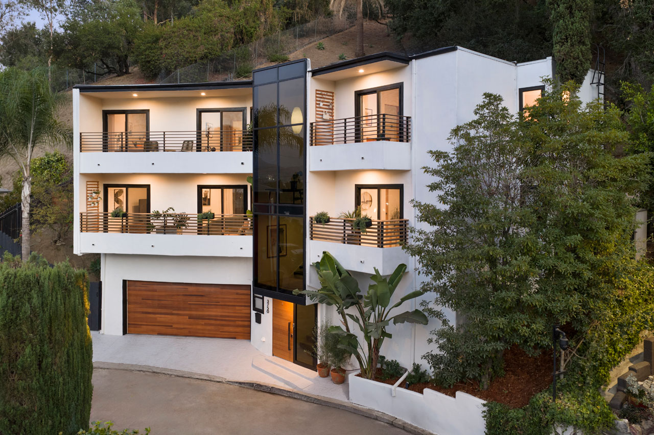 3750 Arbolada Rd Los Feliz, image of a contemporary three story home painted white with black trim and wood details
