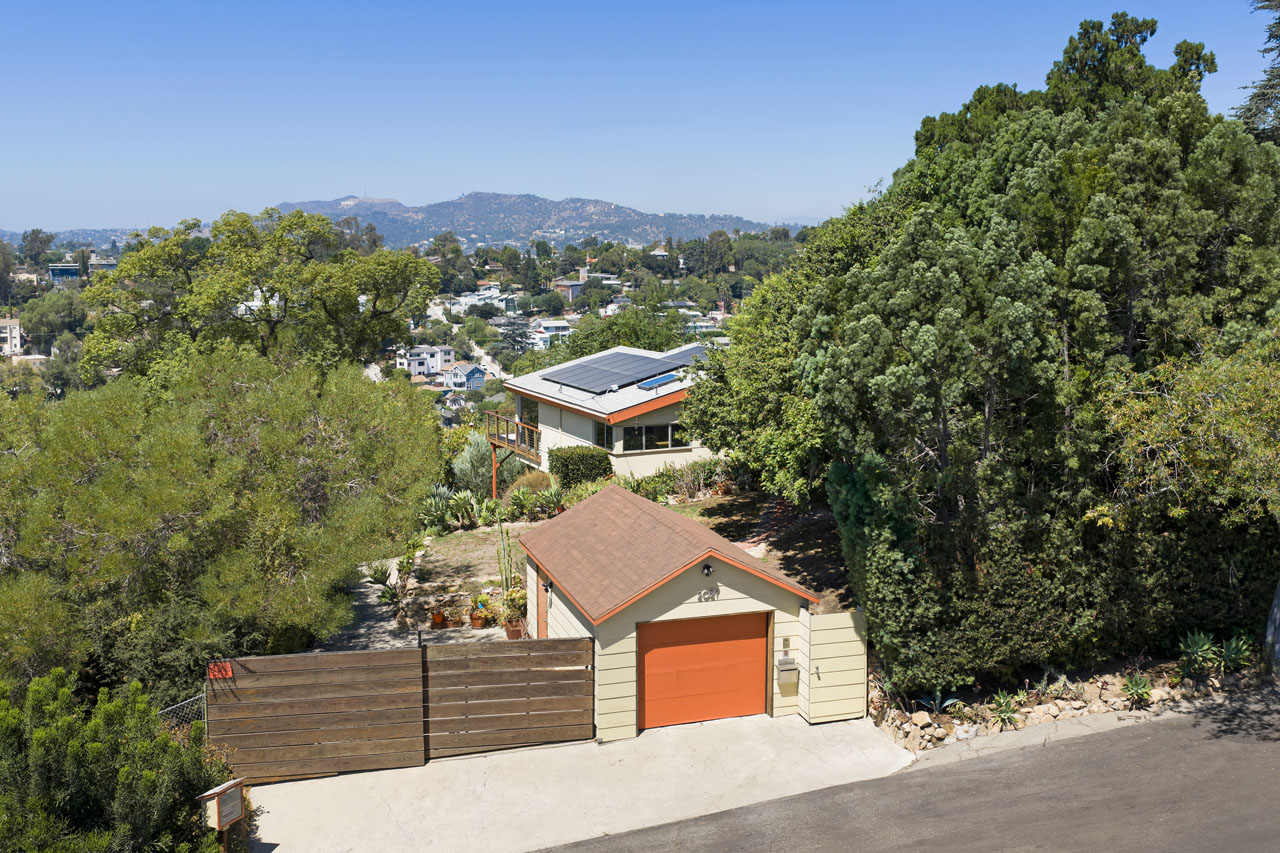 2021 Park Dr Elysian Heights Echo Park image of a home surrounded by greenery with a beige garage with orange garage door